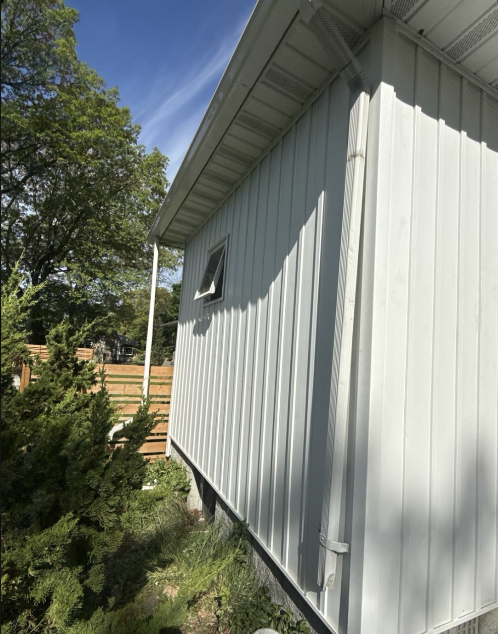 After: fresh vertical siding installed by DuraMax