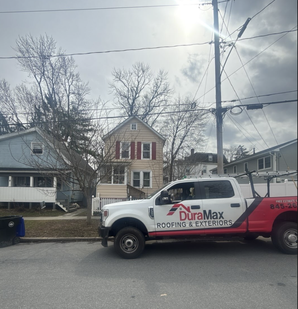 DuraMax Roofing team in front of project truck