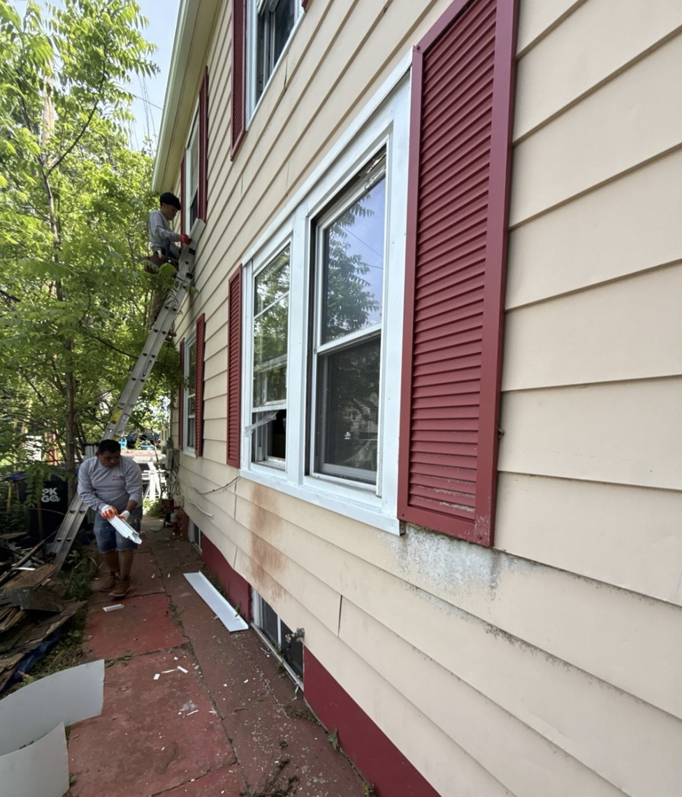 Worn and damaged siding showing signs of aging and weather damage